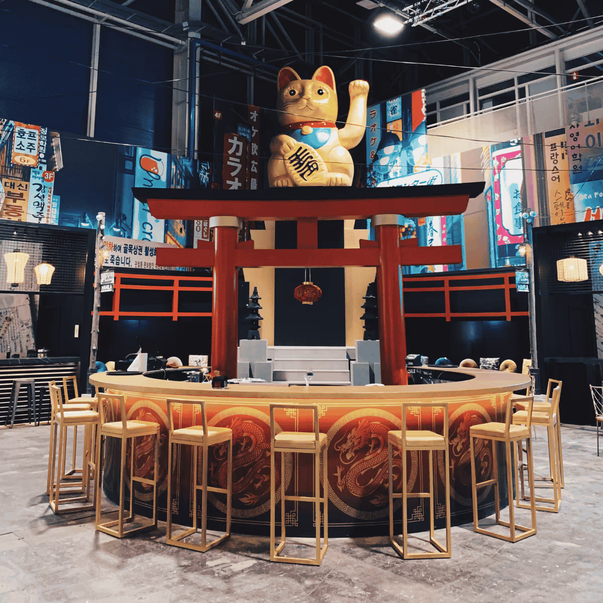 Maneki-neko lucky cat above a torii gate in a modern Japanese bar