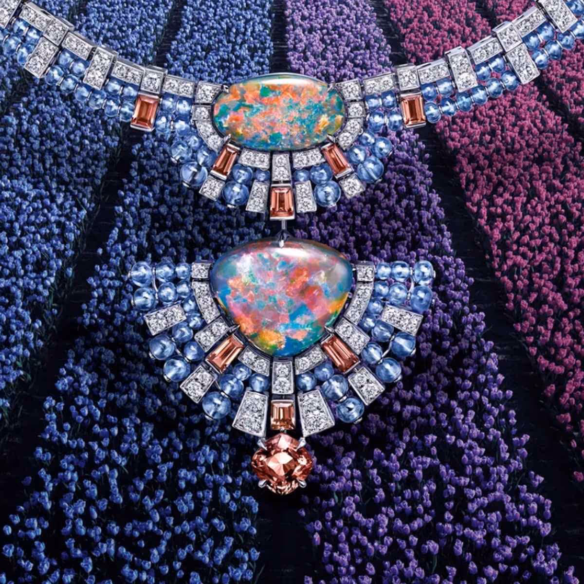 Opal and diamond necklace with multicoloured gemstones on a purple background